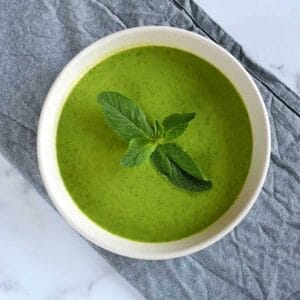 Pea soup with mint in a bowl.