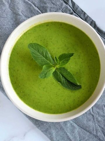 Pea soup with mint in a bowl.