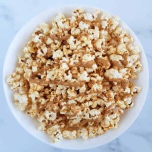 Peanut butter popcorn in a white bowl.