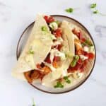 Pork fajitas on a plate.
