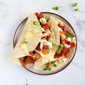 Pork fajitas on a plate.