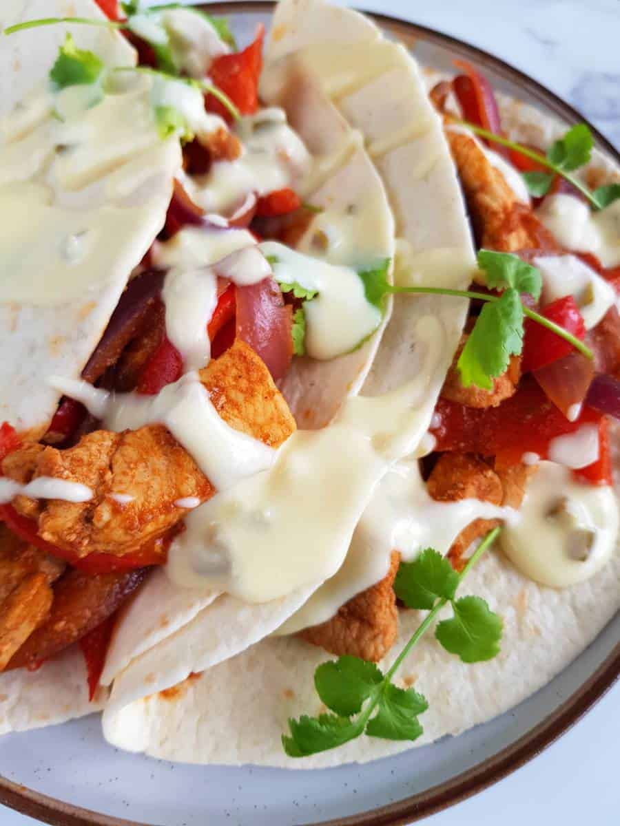 Pork fajitas on a plate.