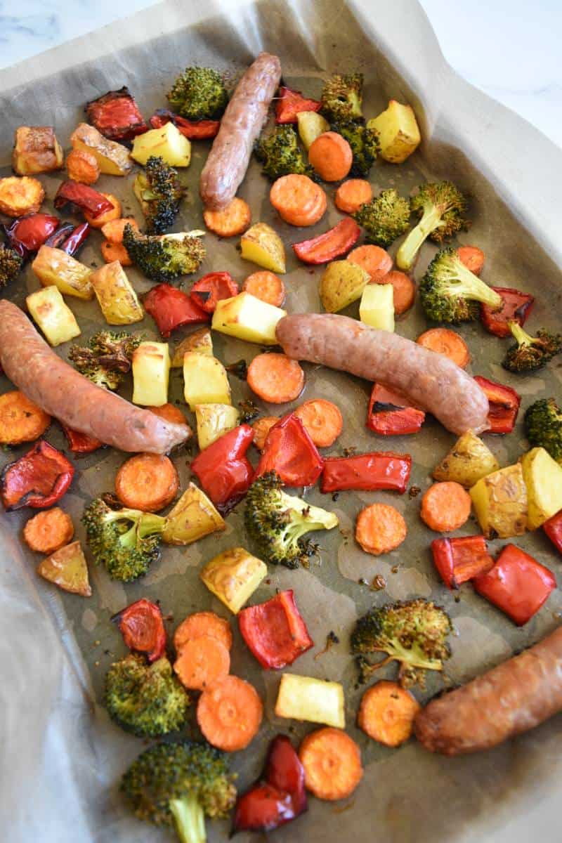 Sausages and veggies on a sheet pan.