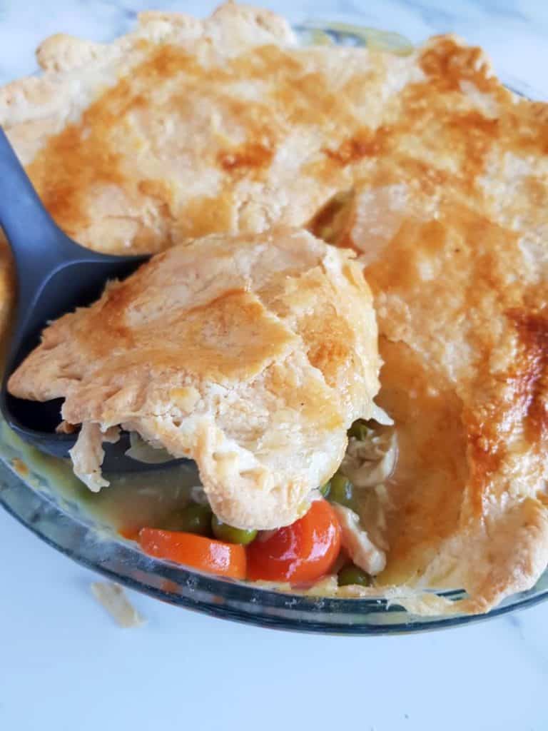 Serving dairy free chicken pot pie with puiff pastry.