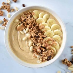 Smoothie bowl with peanut butter and bananas in a bowl.