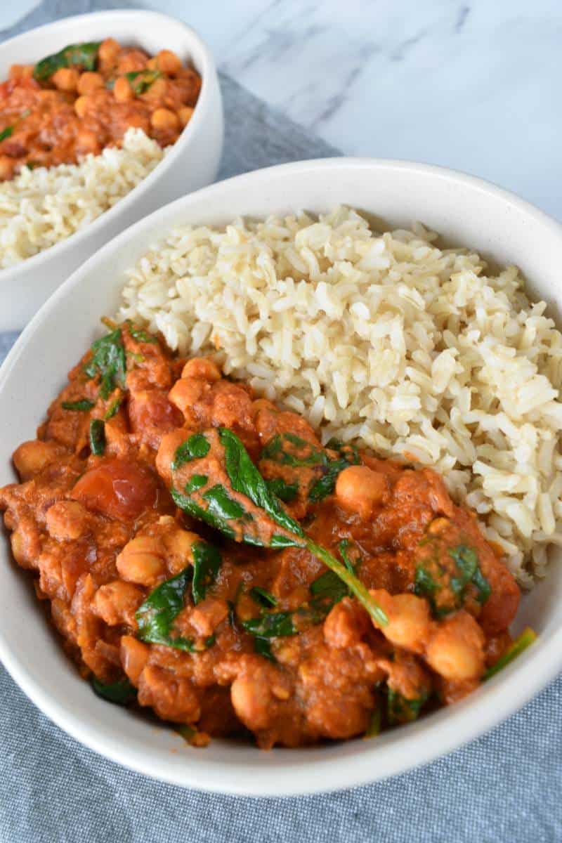 Vegan curry with hummus in two bowls.