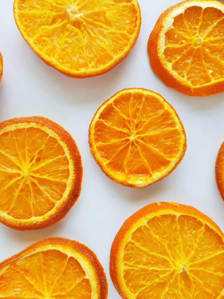 Dried orange slices on a marble table.