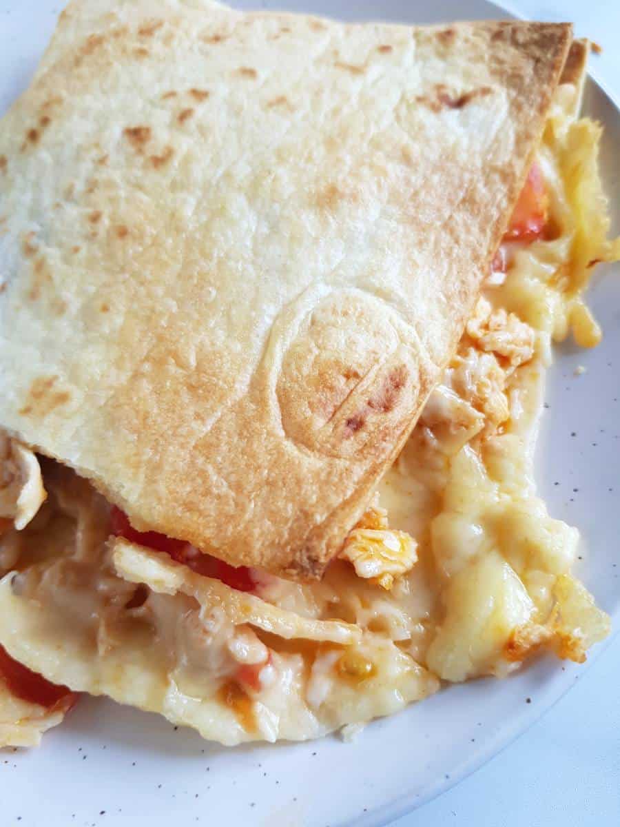 Buffalo chicken quesadillas on a white plate.