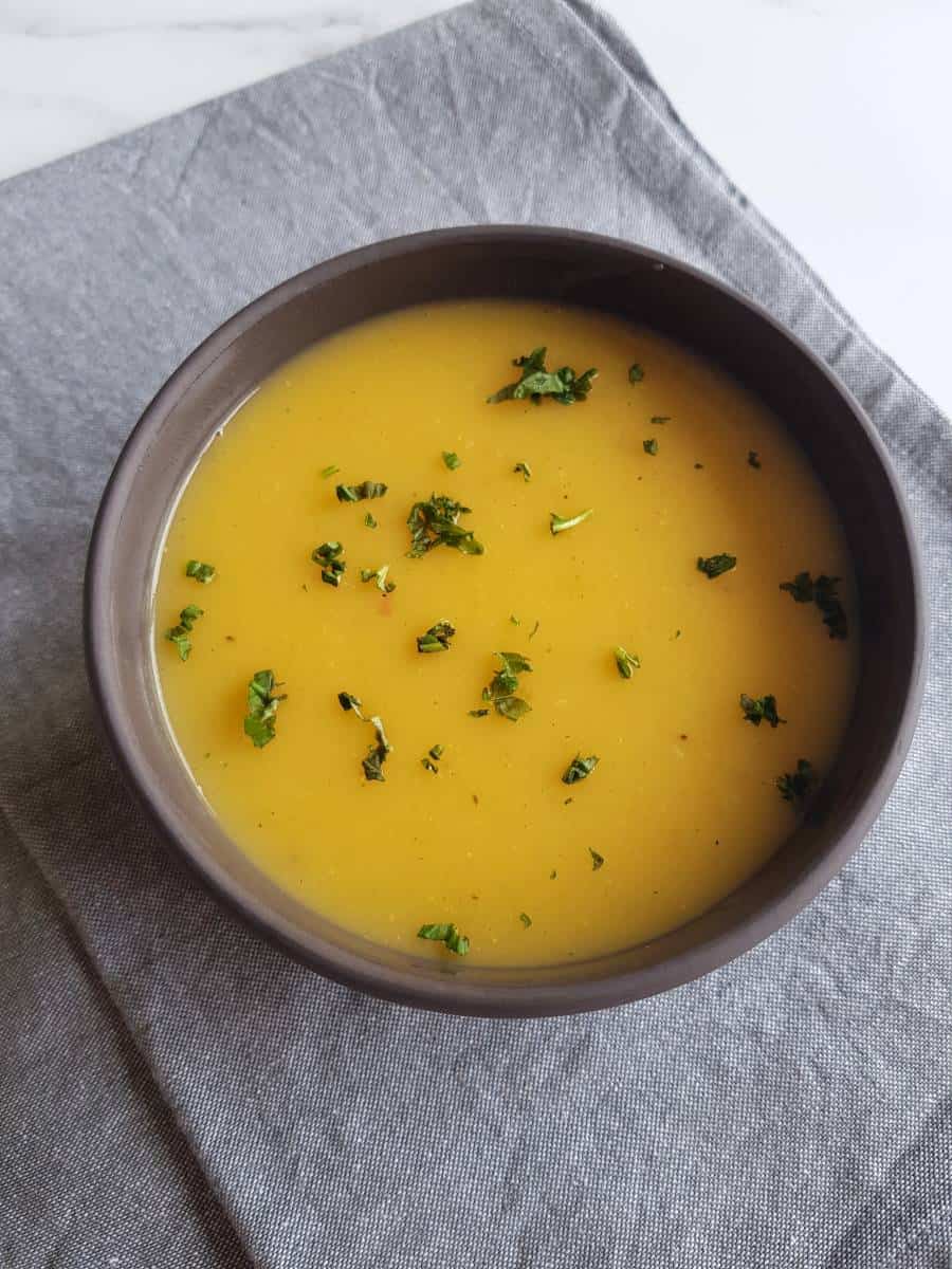 Carrot and potato soup in bowl.