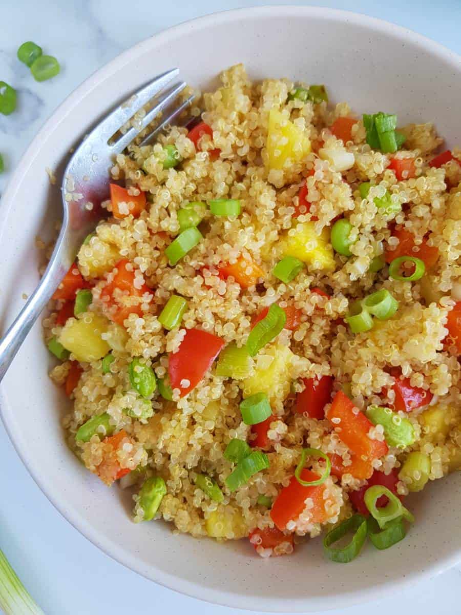 Fried quinoa with pineapple in a bowl.