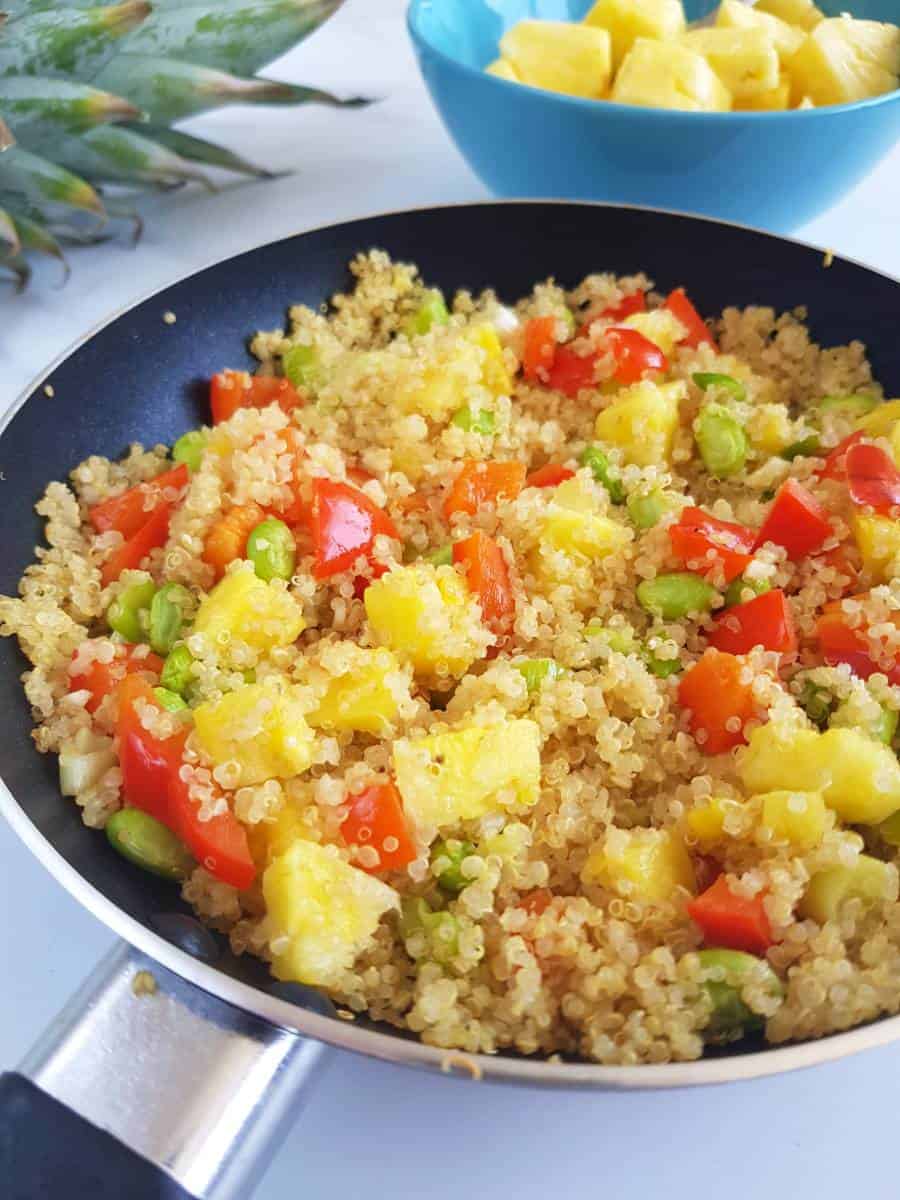 Garlic pineapple fried quinoa in a skillet.