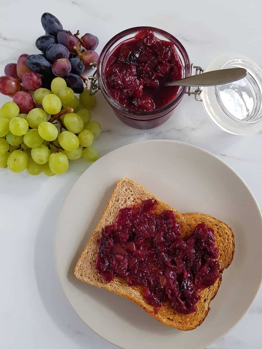 Grape jam with toast and fresh grapes.