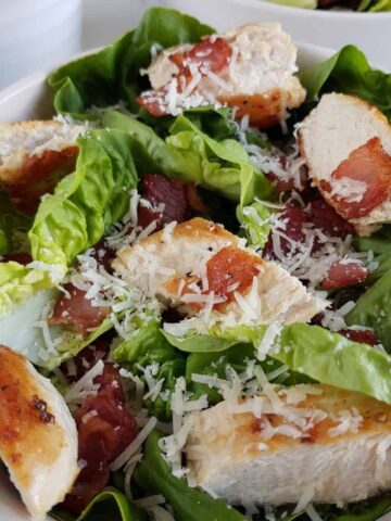 Keto caesar salad with bacon and chicken.