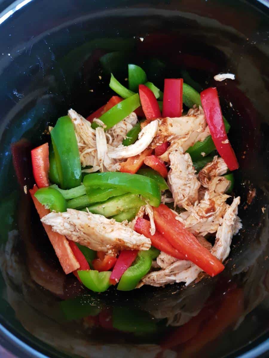 Peppers and chicken in slow cooker.