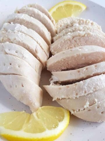 Poached chicken breast fillets.