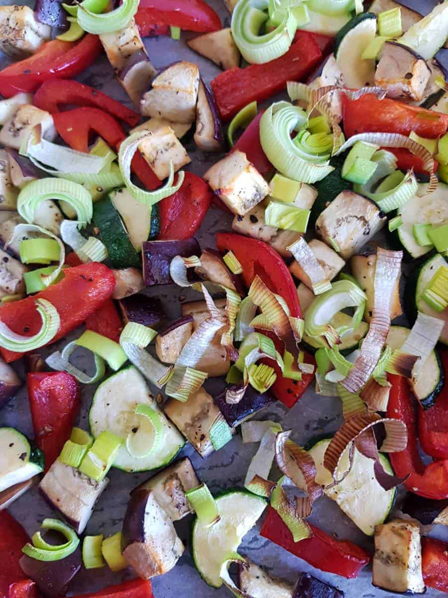 Roasted vegetables on a baking sheet.