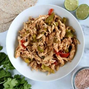 Slow cooker fajita chicken in a bowl.