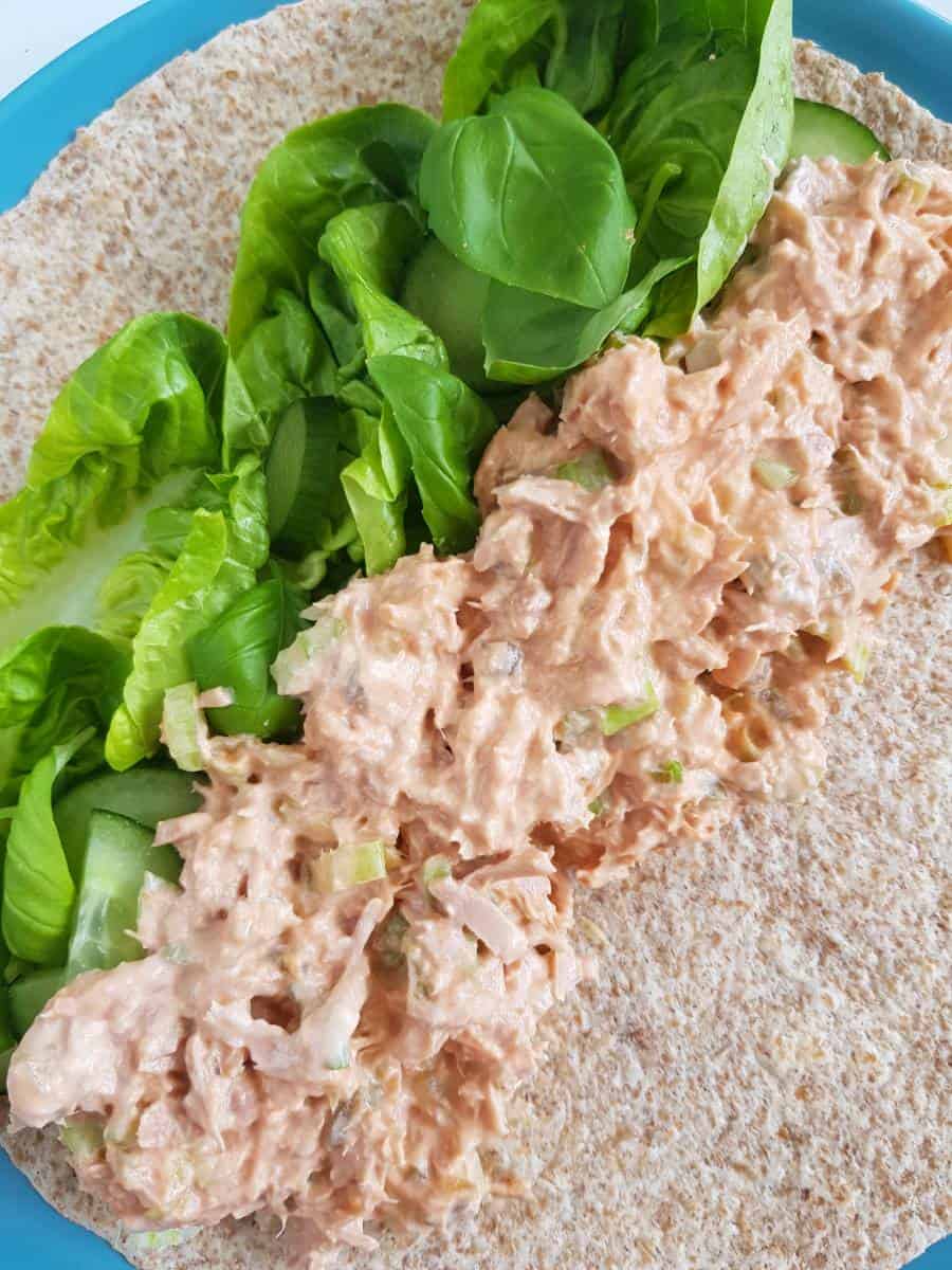 Sriracha tuna wrap with lettuce and cucumber.