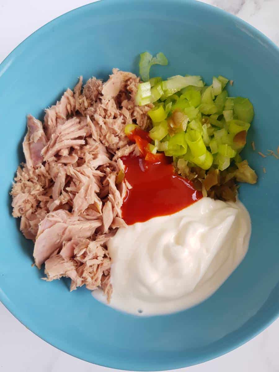 Tuna celery Greek yogurt sriracha in bowl.