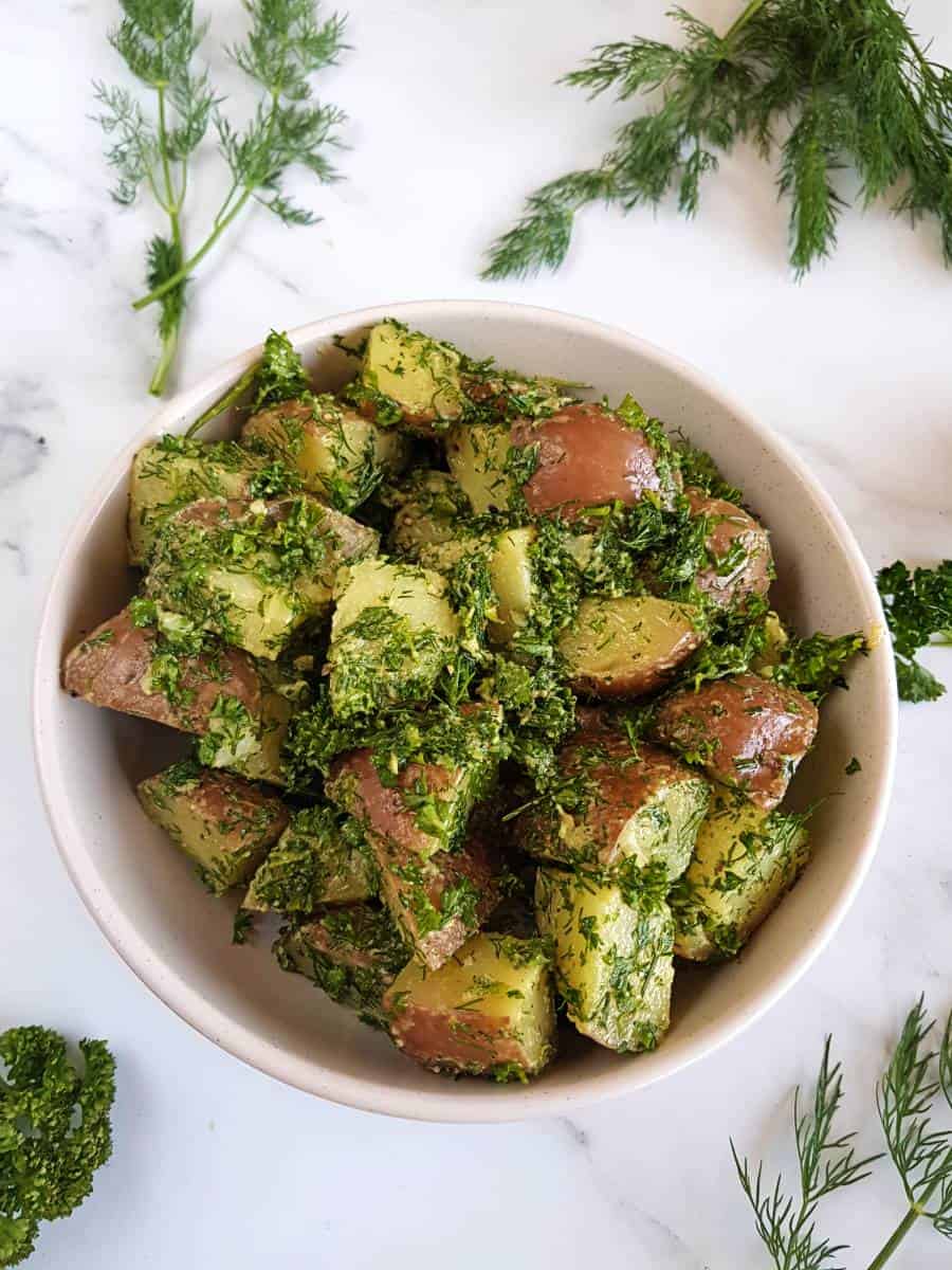 French potato salad with dill and parsley.