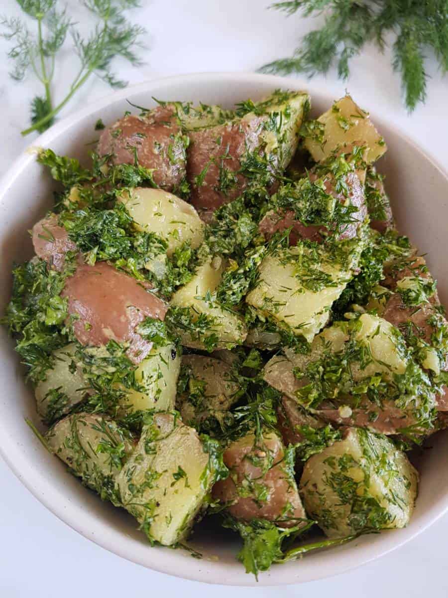 Potato salad with dill and parsley.