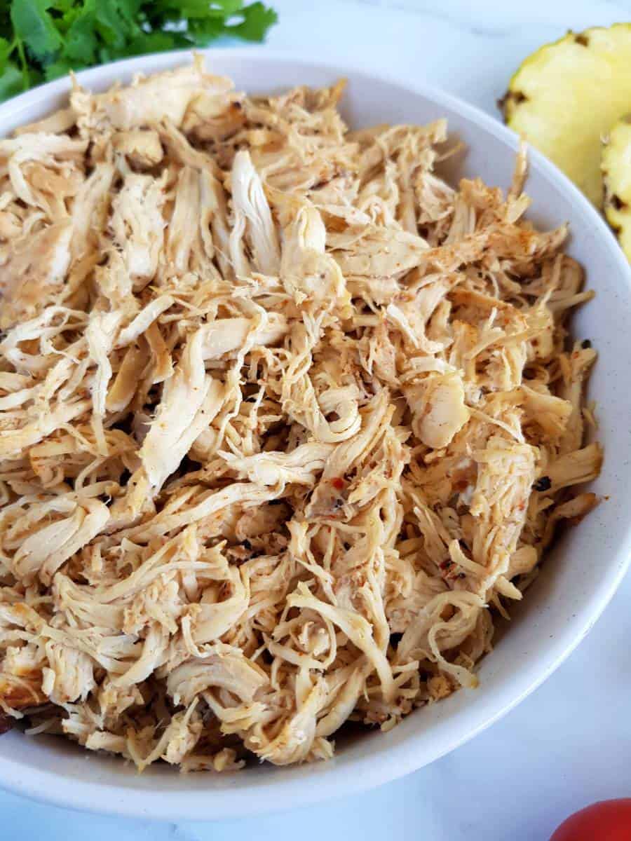 Pulled Cajun chicken in a bowl.