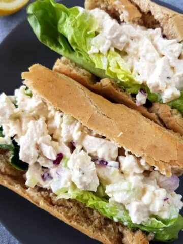 Southern chicken salad in a sandwich with lettuce.