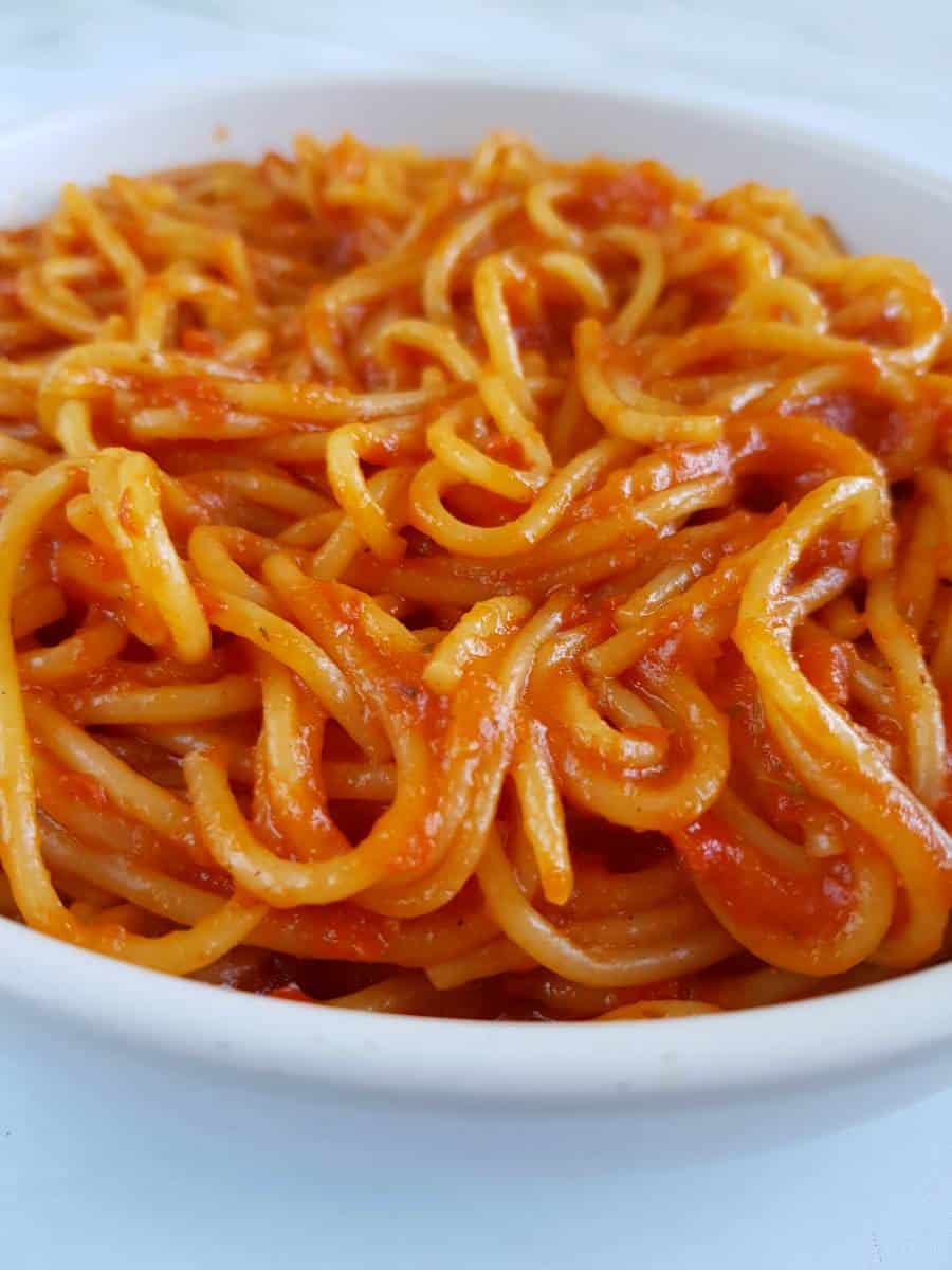 Spaghetti with jollof sauce.