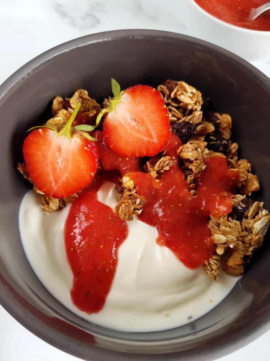 Strawberry sauce on granola.