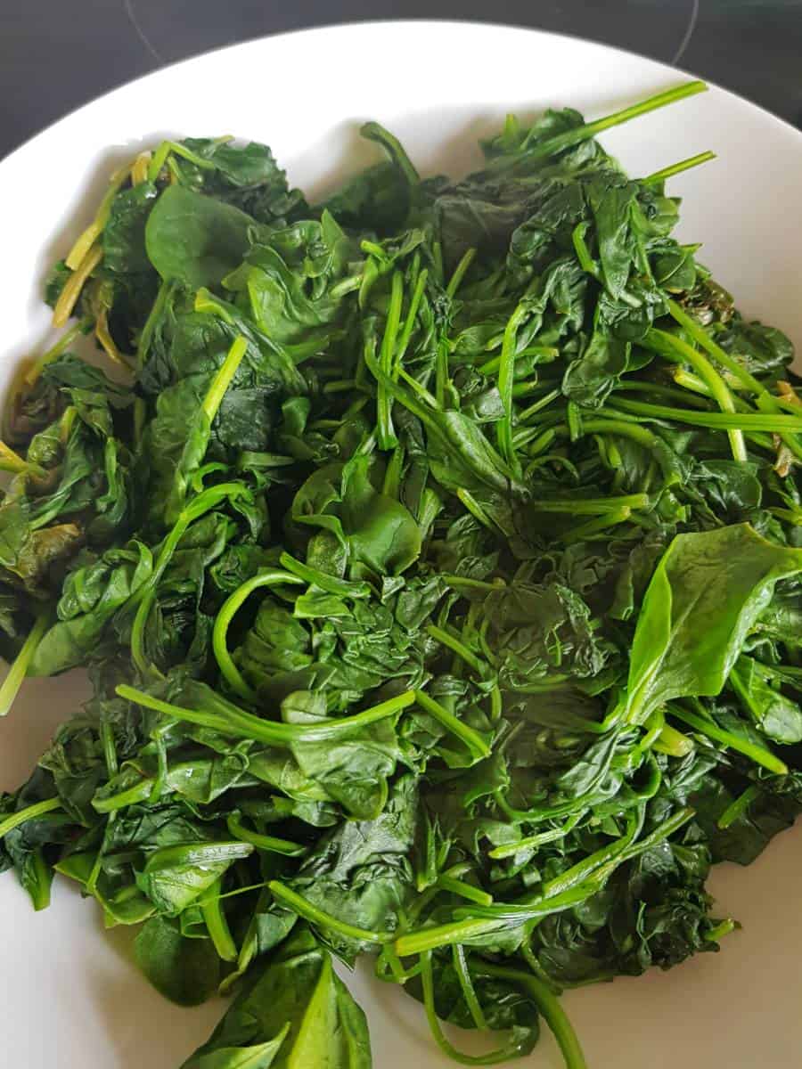 Wilted spinach in a bowl.