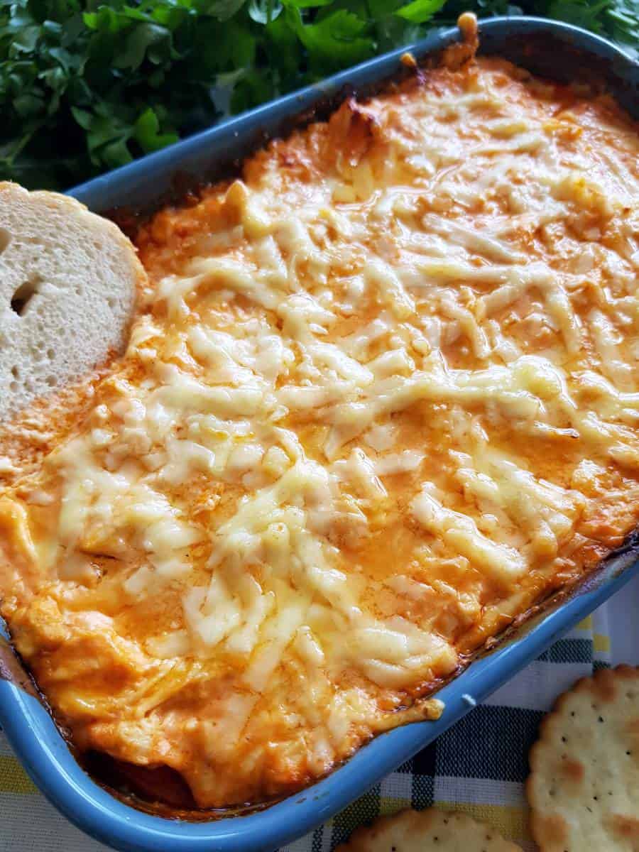 Buffalo chicken dip in a dish.