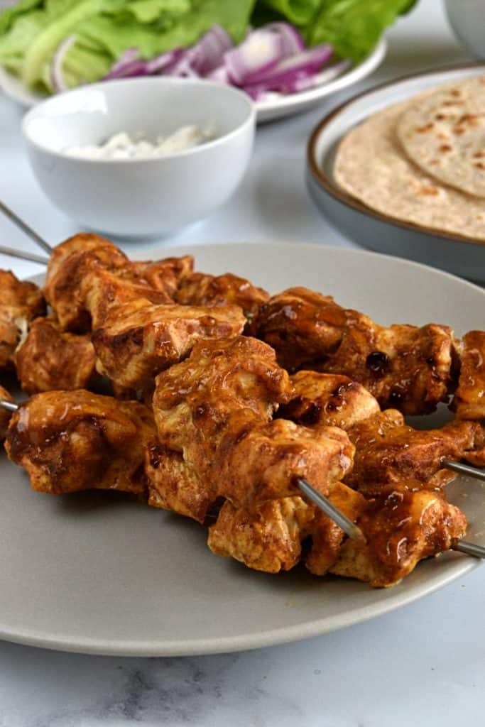 Chicken kebabs with tikka on skewers.