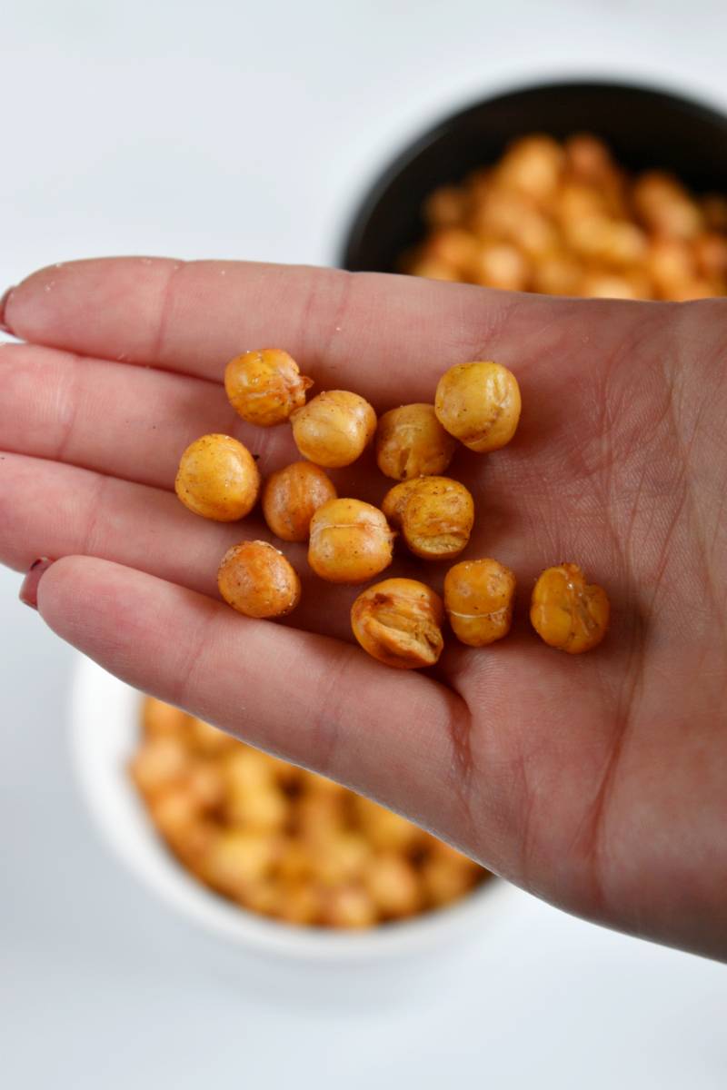 Crunchy chickpeas in a hand.