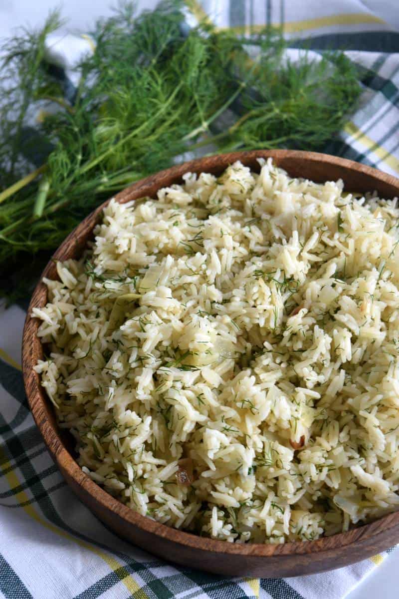 Dill rice in a wooden bowl.