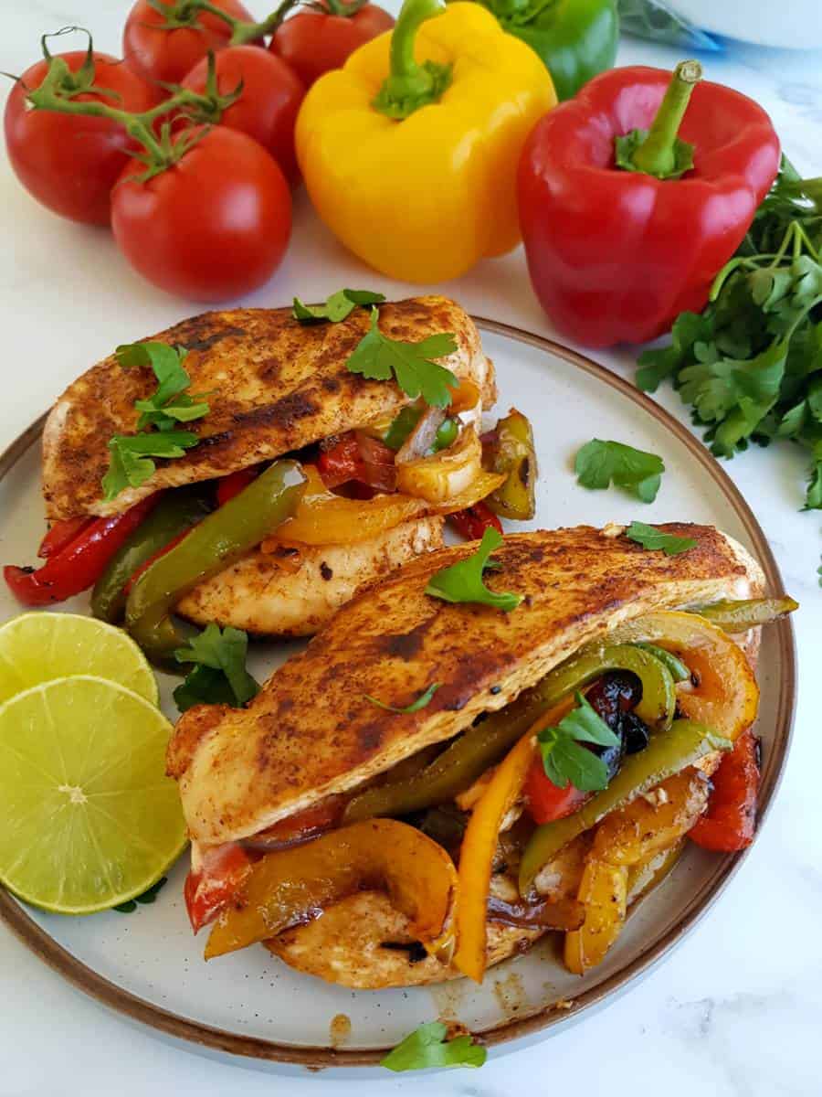 Fajita chicken breasts with peppers, onions and lime.