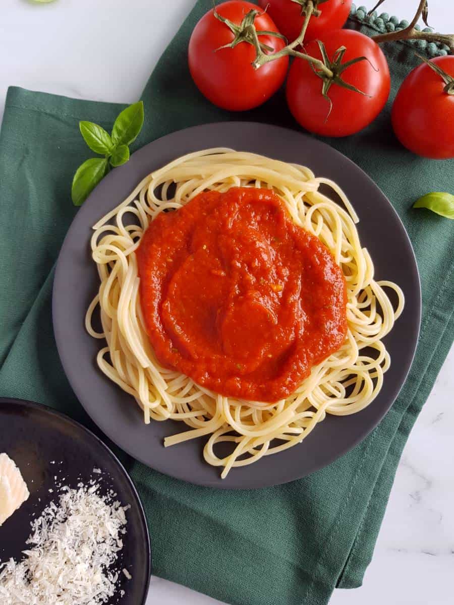 Healthy spaghetti sauce on spaghetti on a plate.