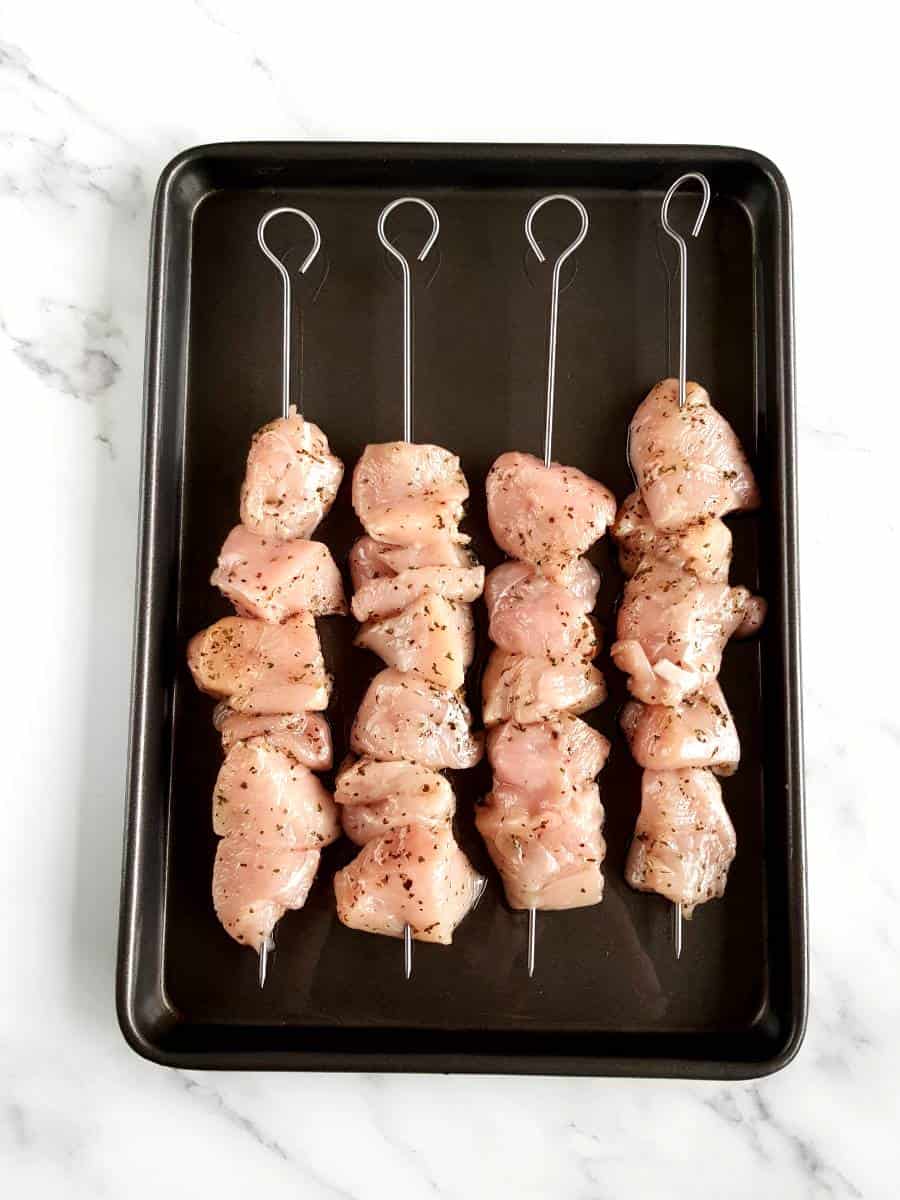 Raw chicken skewers.