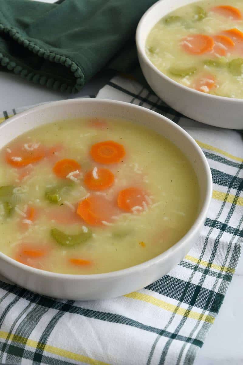 Rice and vegetable soup in bowls on a table.