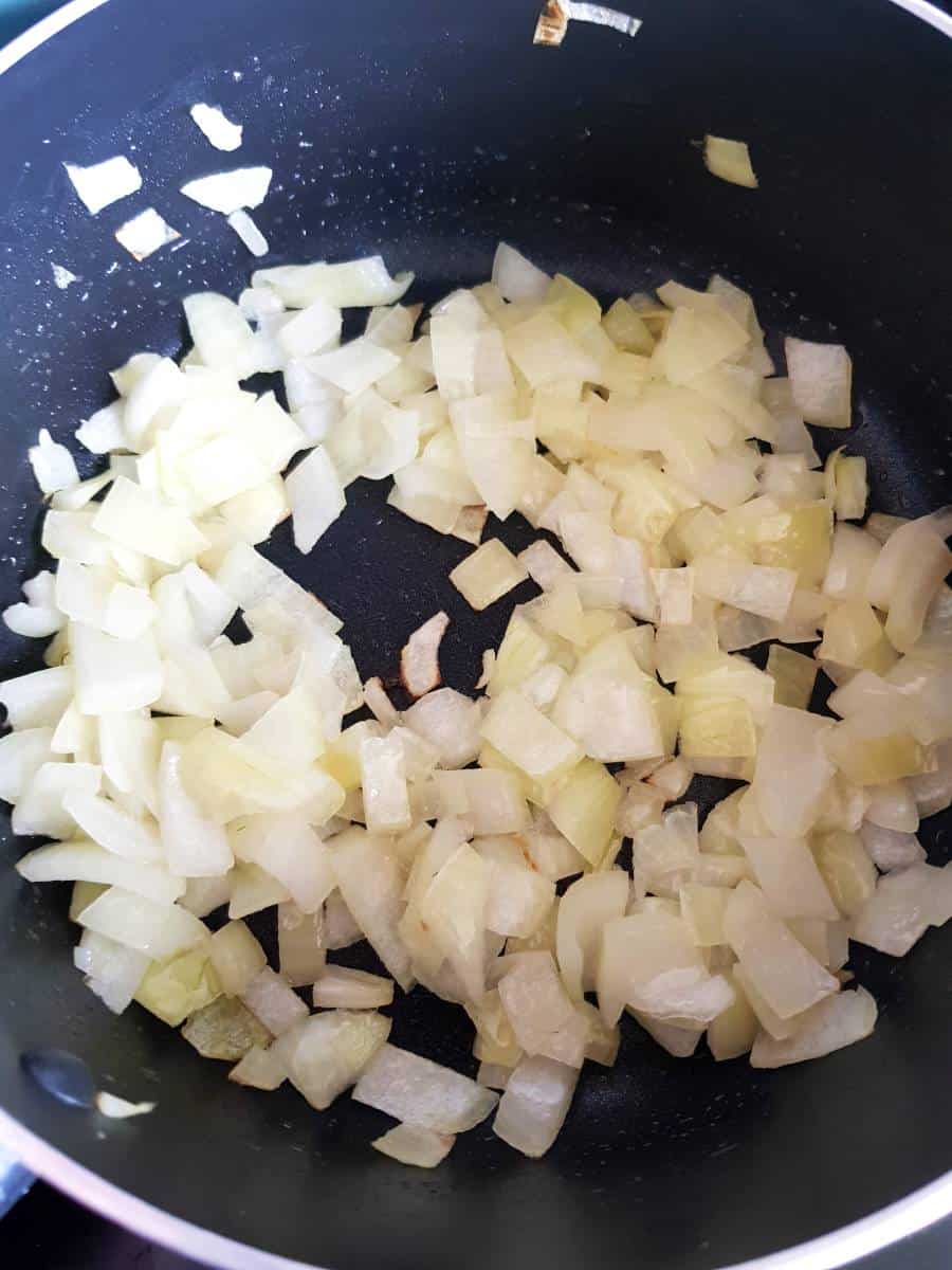 Sauteed onions in a pot.