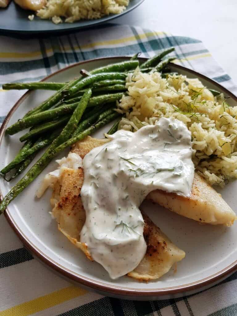 Tilapia with yogurt dill sauce.