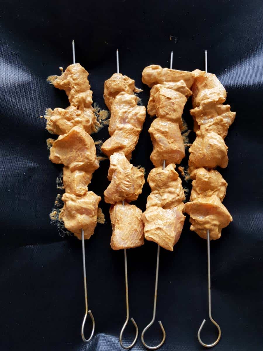 Uncooked chicken skewers.