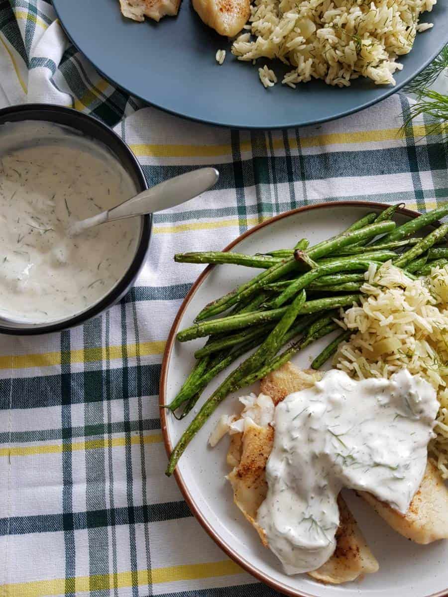 Yogurt sauce with dill on fish.