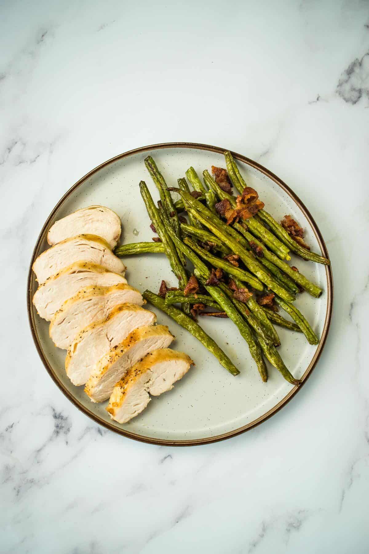 Sliced chicken breast on a plate.