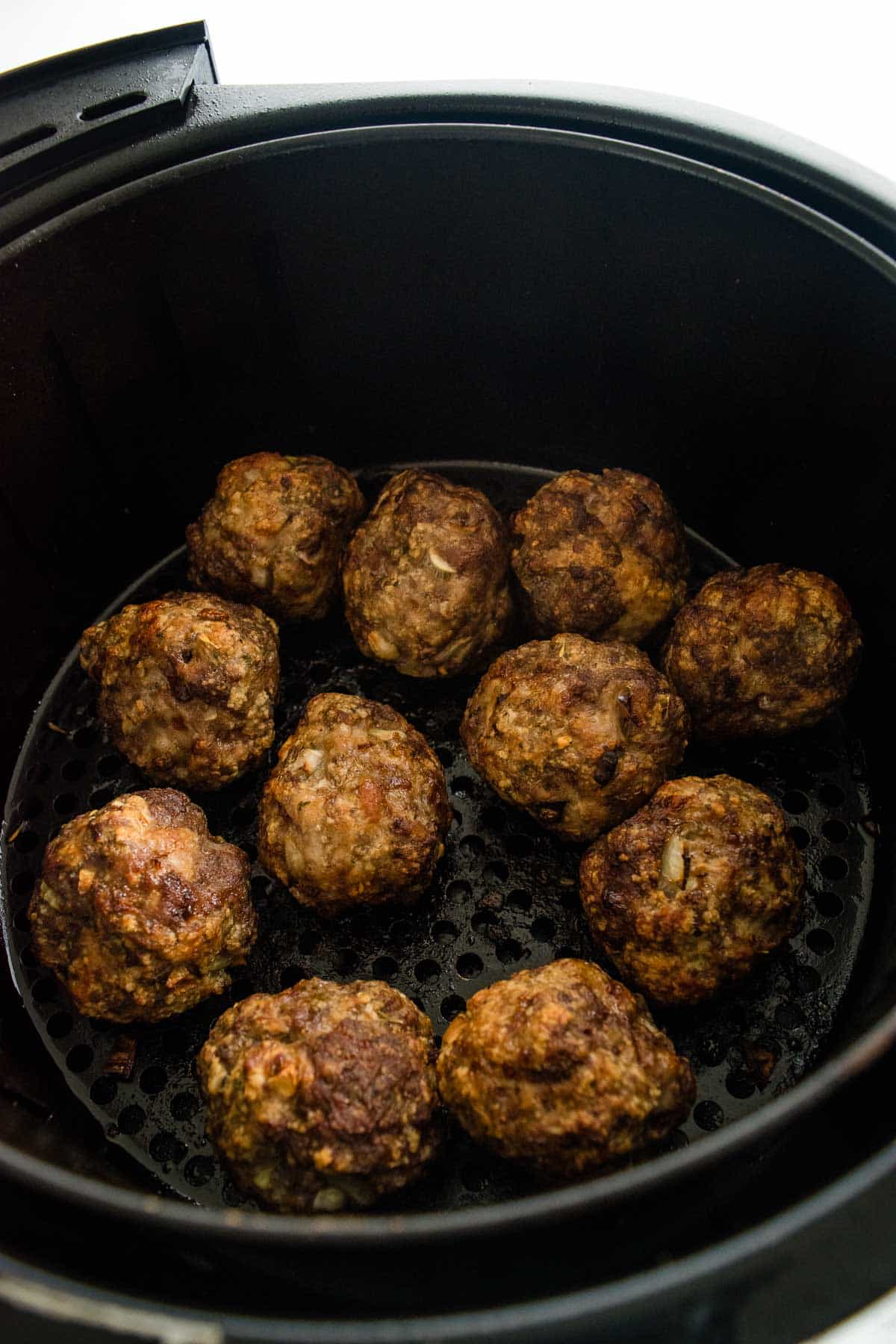 Meatballs in an air fryer.