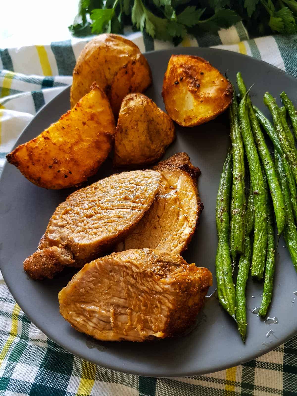 Air fried tenderloin with potatoes and green beans.