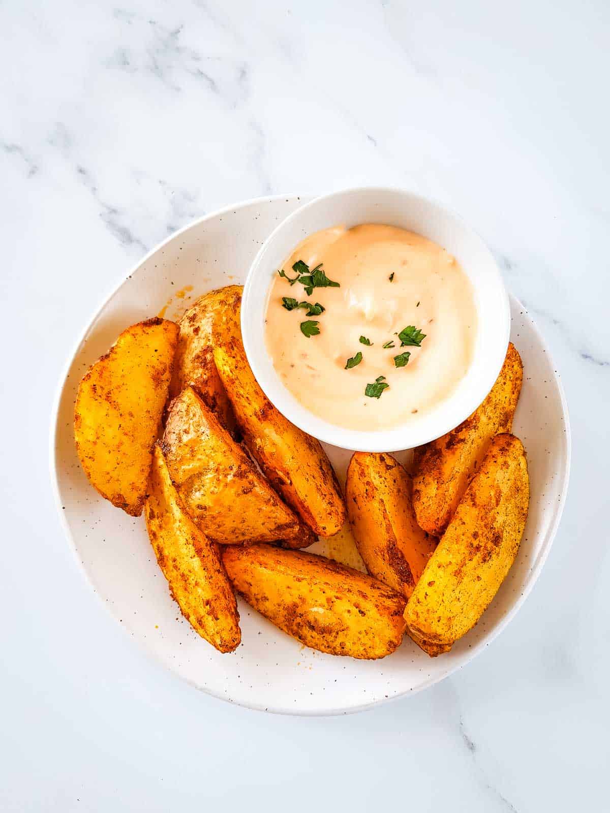 Air fried potato wedges with dip.