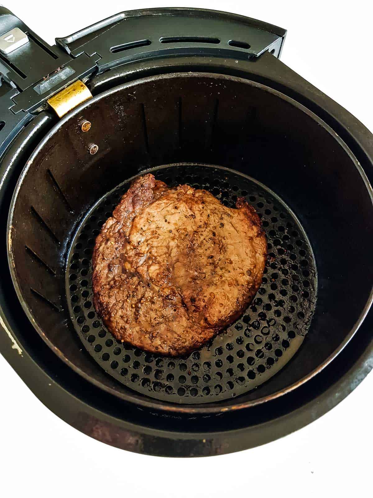 Steak in an air fryer.