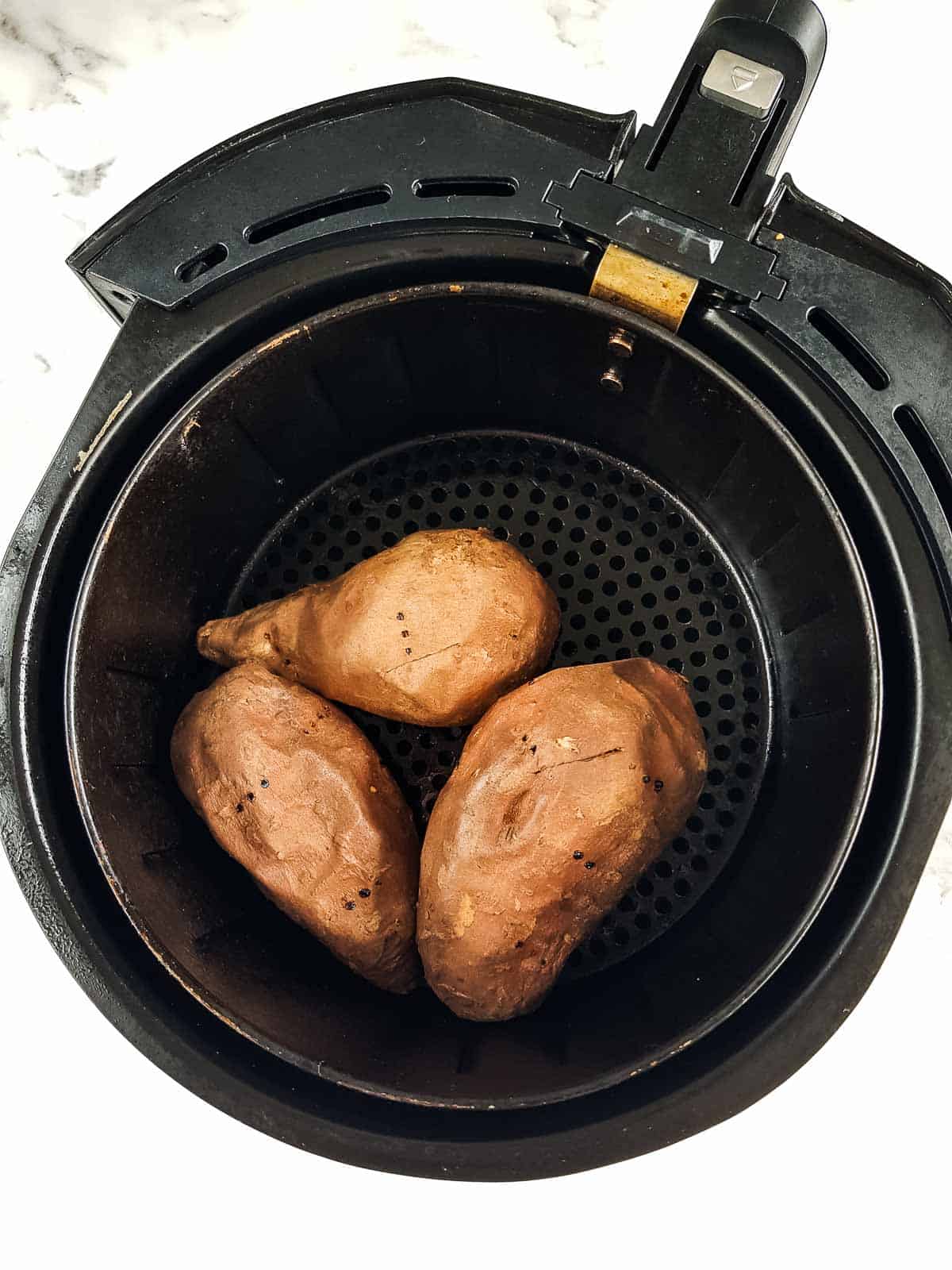 Sweet potatoes in an air fryer.