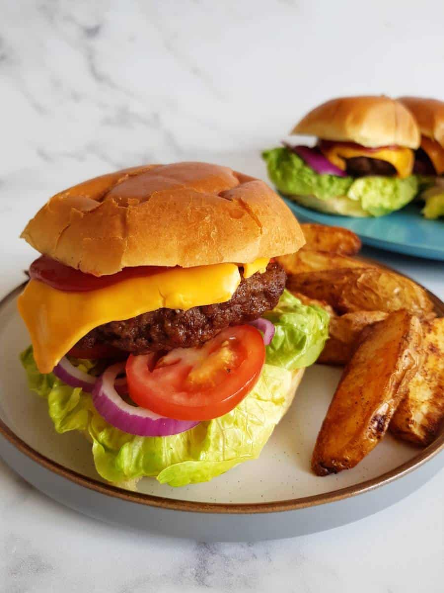 Air fryer hamburgers with potato wedges.