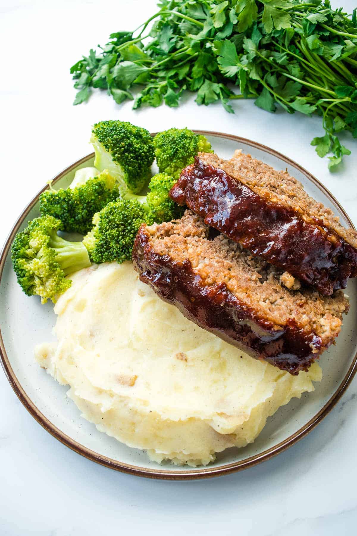 Meatloaf with broccoli and mashed potatoes.